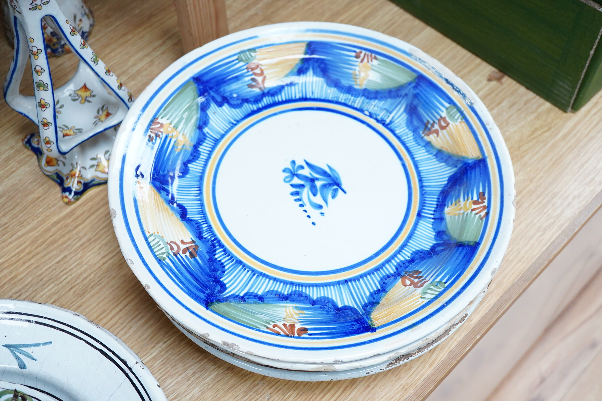 18th and 19th century faience including five chargers and large bowl, latter 30cm